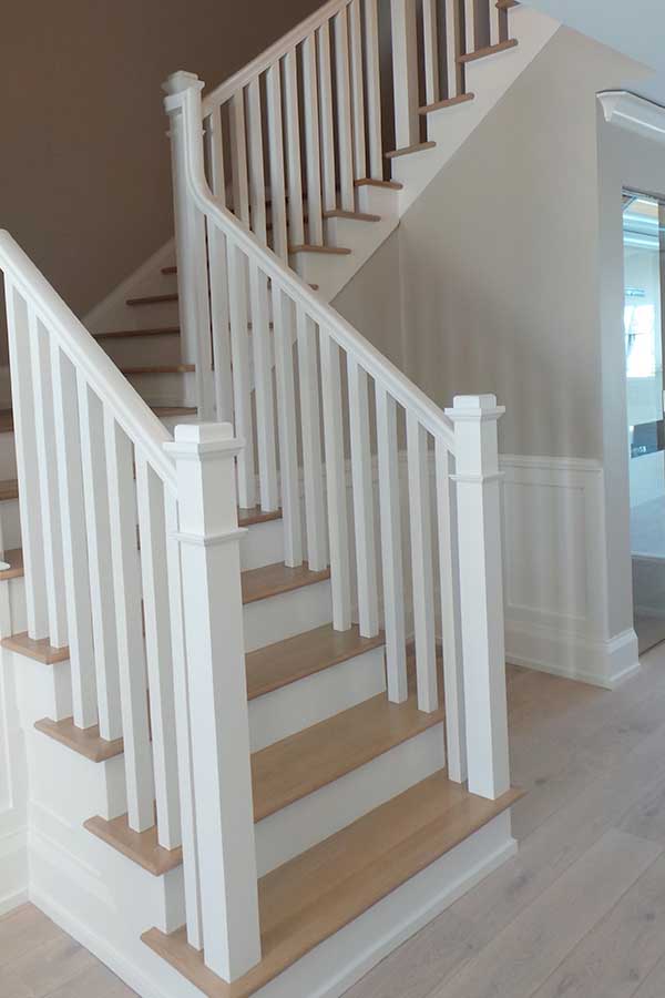 Custom wood staircase built and installed by Scholten Construction Custom Home Builders
